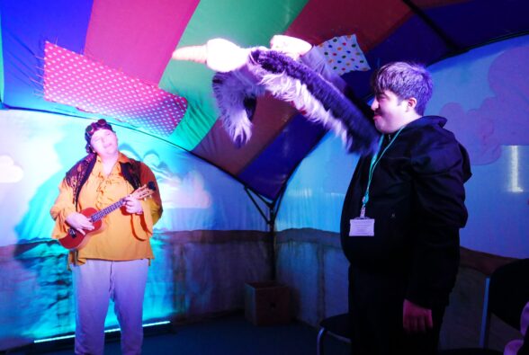 Amer Gawhari, Skills for Living student, makes the Albatross puppet fly. Rosie Horler-Taylor, 7Sense Co-creative Lead and Development Manager at Make/Sense Theatre plays and sings a song in the background. 