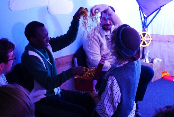Gideon Agyekum, Skills for Living student, plays with treasure with Jess Kay, 7Sense Performer at Make/Sense Theatre. 